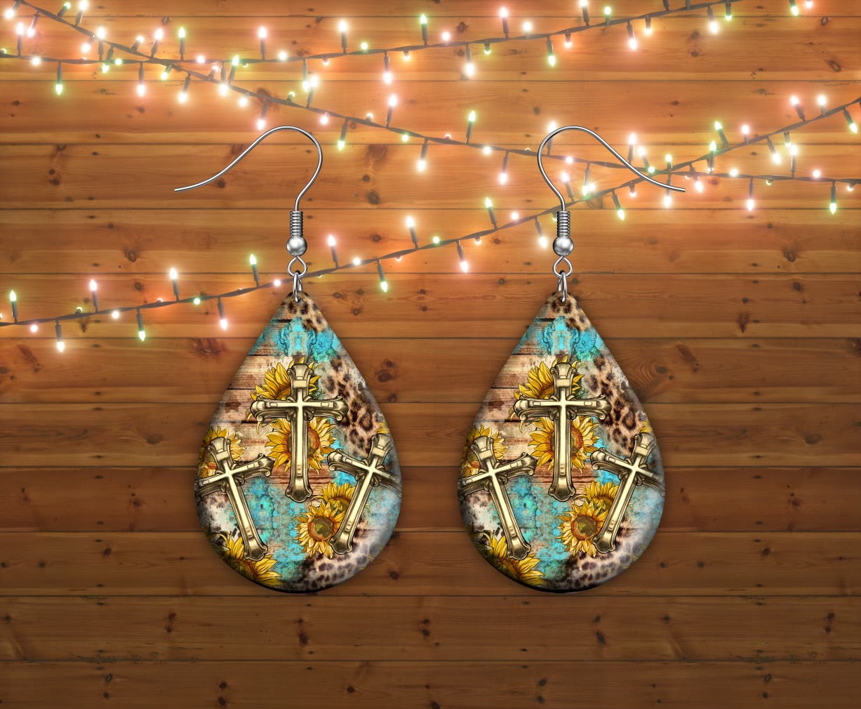 Three crosses teal earrings